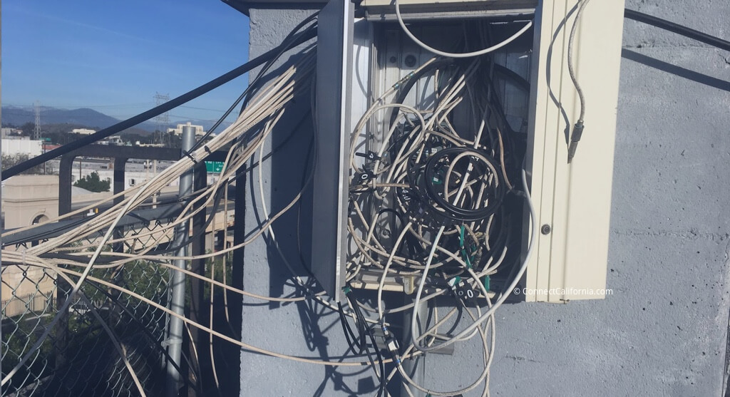 Image of cables in utility cabinet.